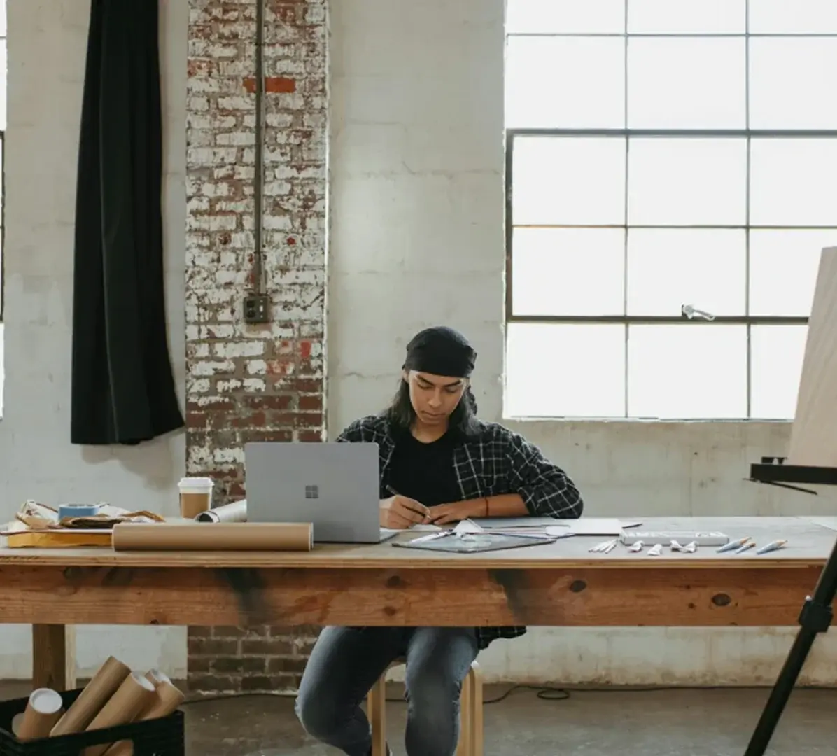 architectural-designer-workspace-plans-laptop-studio