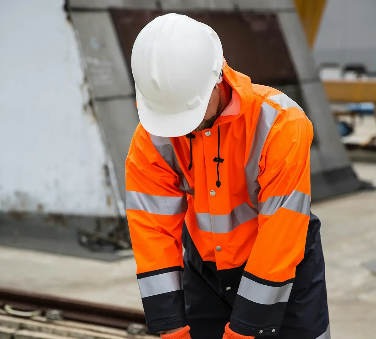 construction-worker-safety-rain-gear-site-inspection