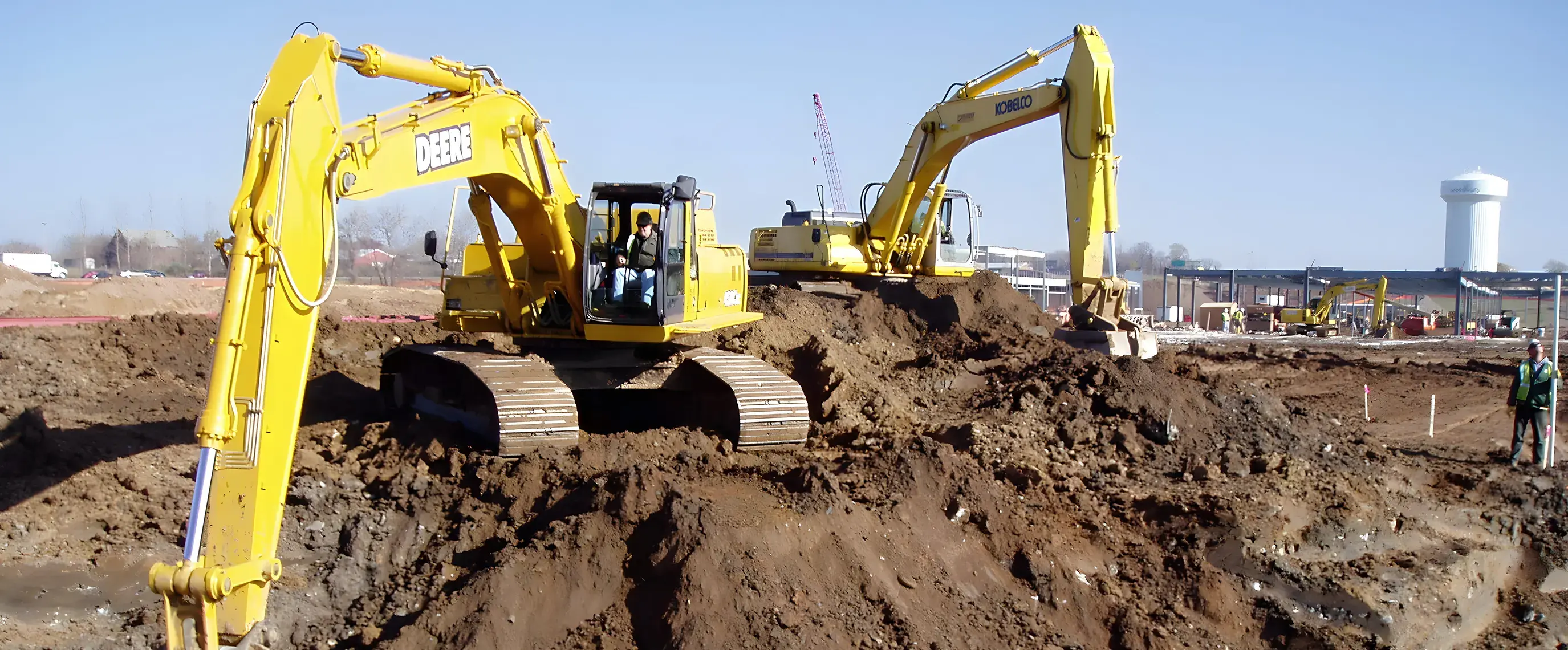 excavators-performing-earthworks-at-construction-site